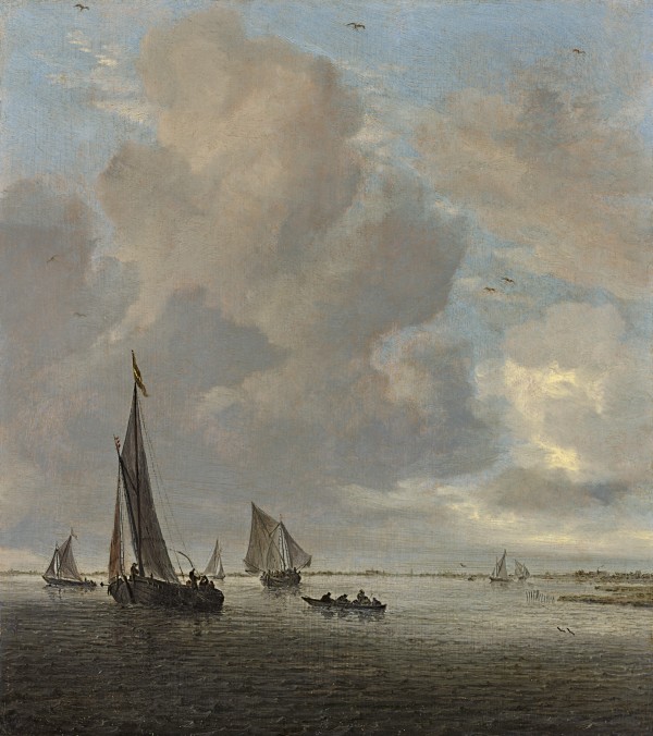 River estuary with wijdschips, a rowing boat and other small vessels